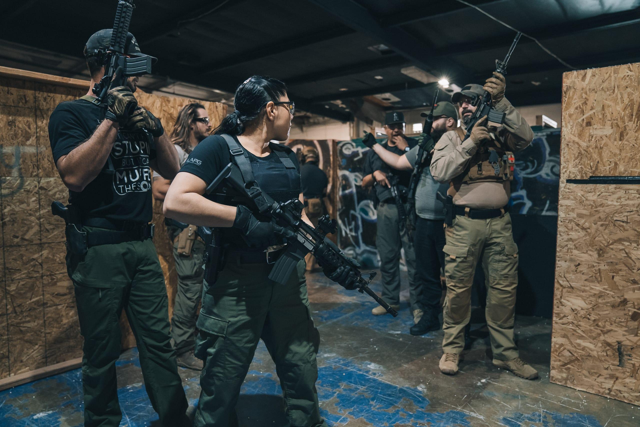 A team working a room inside a shoot house during CQB training