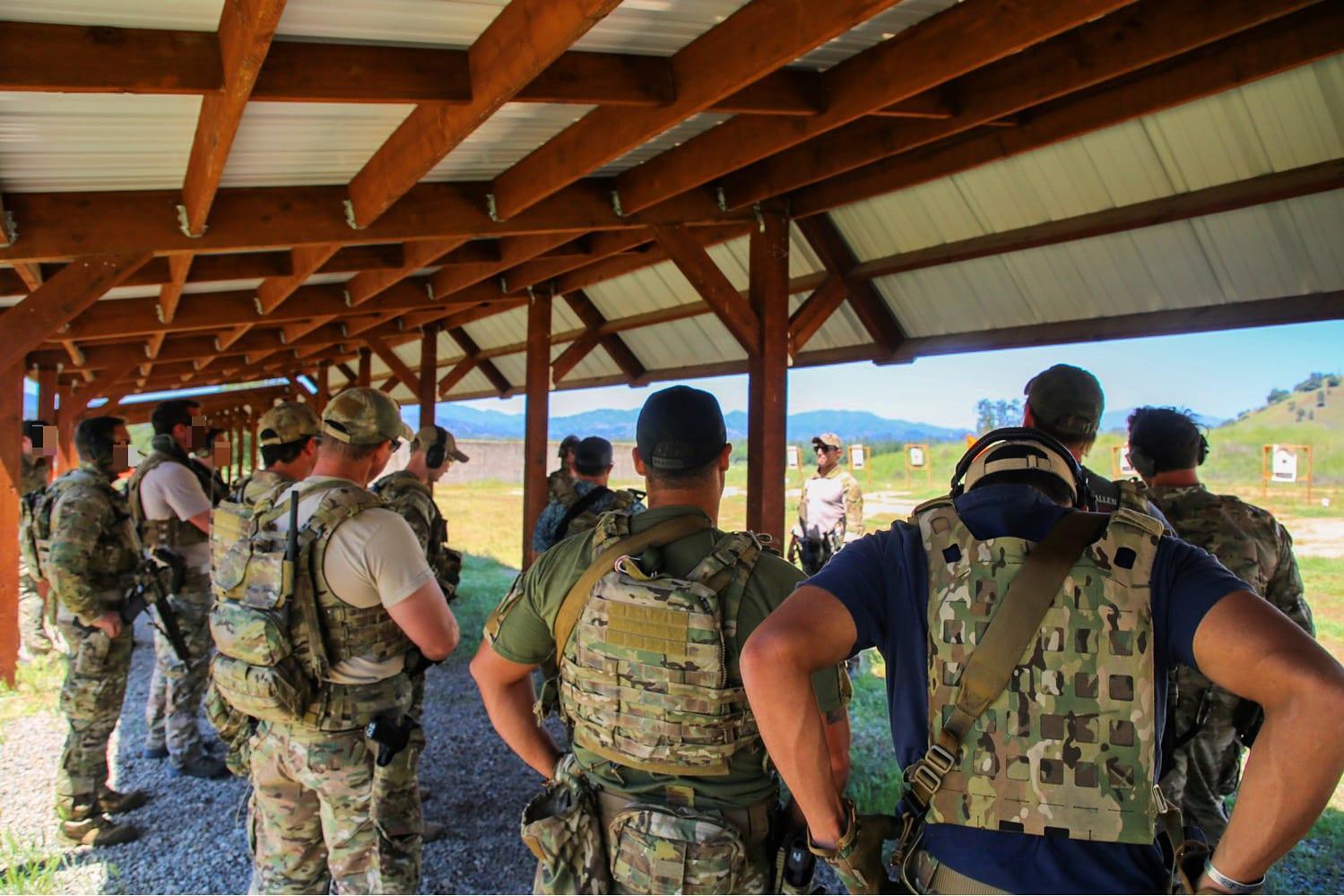 Instructor briefing a small group before a training serial